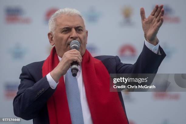 Turkey's Prime Minister Binali Yildirim address the crowd ahead of the arrival of Turkey's President Recep Tayyip Erdogan during a AK Parti election...