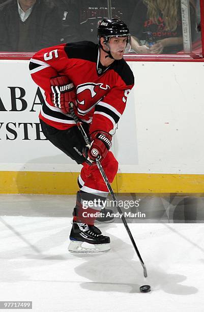 Colin White of the New Jersey Devils plays the puck against the Pittsburgh Penguins during the game at the Prudential Center on March 12, 2010 in...