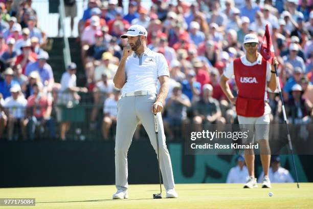 Dustin Johnson of the United States reacts to a bogey on the seventh green during the final round of the 2018 U.S. Open at Shinnecock Hills Golf Club...