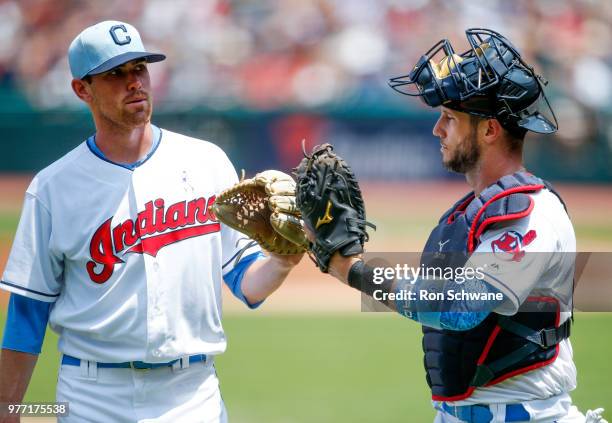 Shane Bieber and Yan Gomes of the Cleveland Indians walk off the field against the Minnesota Twins during the first inning at Progressive Field on...