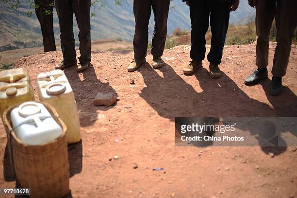 Villagers wait to get water at a drinking water supply point on March 15, 2010 in Huili County of Liangshan Yi Autonomous Prefecture, Sichuan...