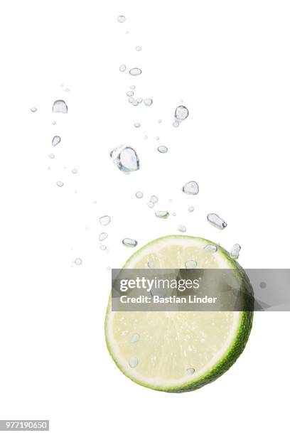 lime in water with air bubbles - lemon on an injury stock pictures, royalty-free photos & images