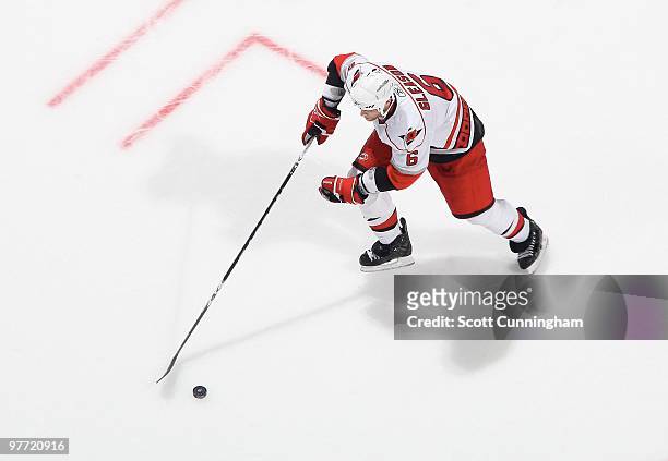 Tim Gleason of the Carolina Hurricanes carries the puck against the Atlanta Thrashers at Philips Arena on March 7, 2010 in Atlanta, Georgia.