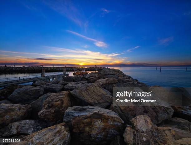 breakwater at sunset, holdfast bay, adelaide, south australia - bay adelaide stock pictures, royalty-free photos & images