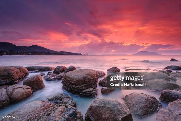 last light at samudera beach, singkawang - singkawang stock pictures, royalty-free photos & images