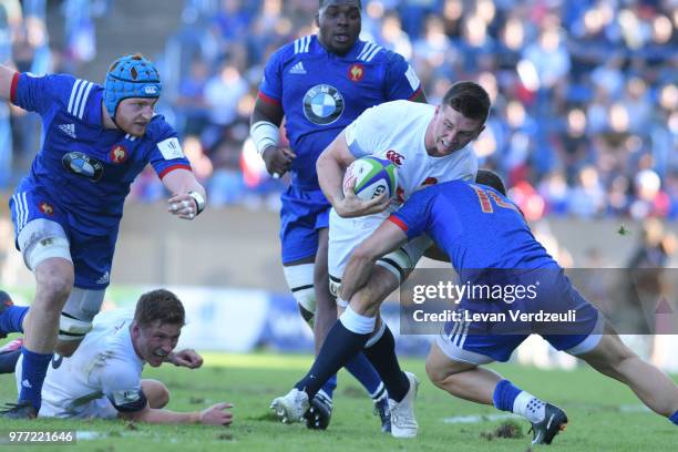 Ben Curry of Enland is tackled during the World Rugby Under 20 Championship Final between England and France on June 17, 2018 in Beziers, France.