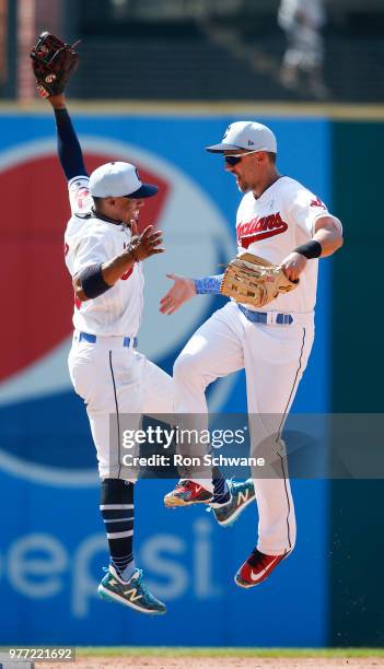 Francisco Lindor and Lonnie Chisenhall of the Cleveland Indians celebrate a 4-1 victory over the Minnesota Twins at Progressive Field on June 17,...