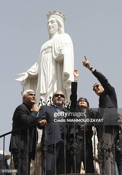 Mexican tycoon Carlos Slim visits the Virgin Mary statue at the entrance at his family's homwtwon Jezzine in southern Lebanon on March 15, 2010....