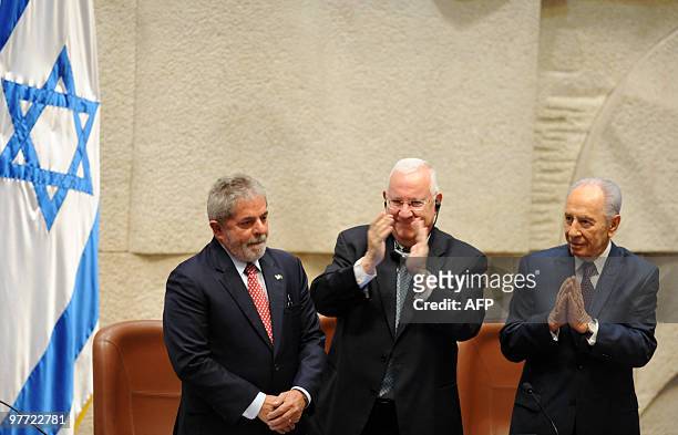 Israeli President Shimon Peres and Parliament Speaker Reuven Rivlin applaud as parliament members welcome Brazilian President Luiz Inacio Lula da...