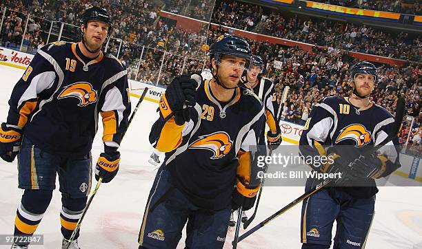 Tim Connolly, Jason Pominville and Henrik Tallinder of the Buffalo Sabres ceelbrate a goal against the Dallas Stars on March 10, 2010 at HSBC Arena...