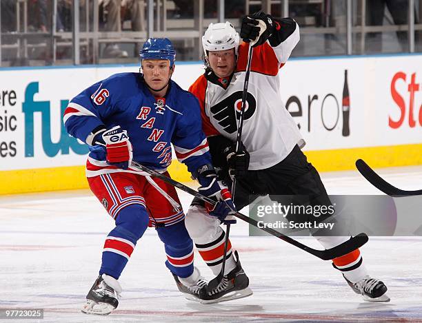 Sean Avery of the New York Rangers skates against Arron Asham of the Philadelphia Flyers on March 14, 2010 at Madison Square Garden in New York City.