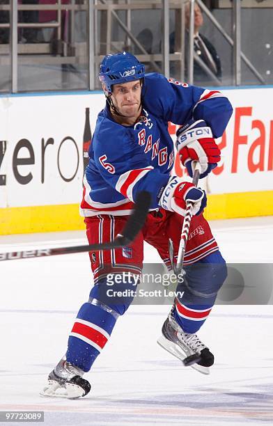 Dan Girardi of the New York Rangers passes the puck against the Philadelphia Flyers on March 14, 2010 at Madison Square Garden in New York City. The...