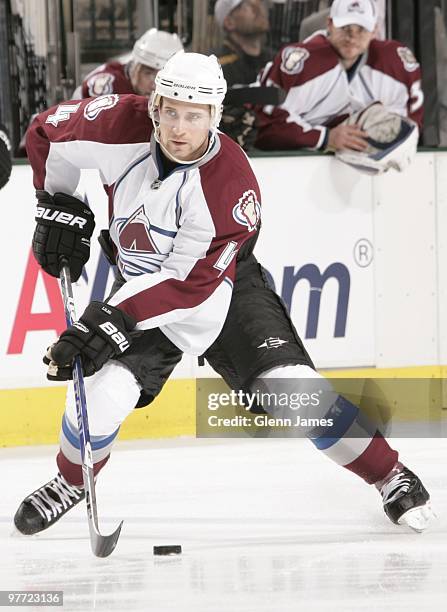 John-Michael Liles of the Colorado Avalanche handles the puck against the Dallas Stars on March 14, 2010 at the American Airlines Center in Dallas,...