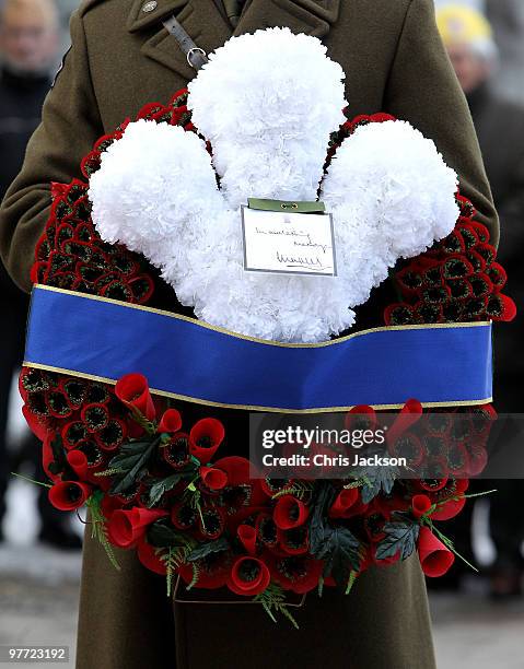 Soldier holds the wreath which Camilla Duchess of Cornwall and Prince Charles will lay, Prince of Wales prepare to lay a wreath at the Popieluszko...