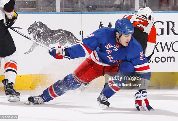 Brian Boyle of the New York Rangers skates against Simon Gagne of the Philadelphia Flyers on March 14, 2010 at Madison Square Garden in New York...