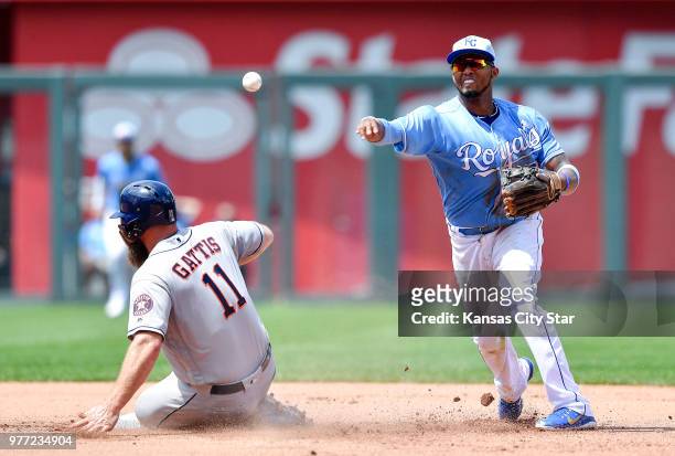 Kansas City Royals shortstop Alcides Escobar forces out Houston Astros' Evan Gattis and completes the double play on Brian McCann to end the top of...