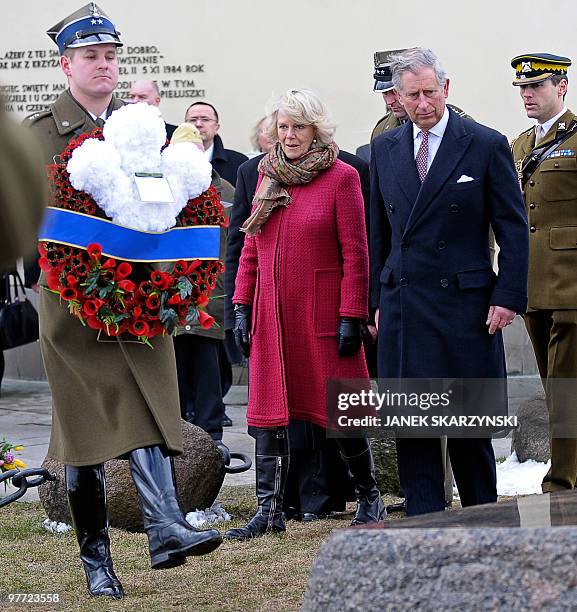 Britain's Prince Charles and Camilla, the Duchess of Cornwall lay a wreath at the grave of priest Jerzy Popieluszko, a Roman Catholic priest and...