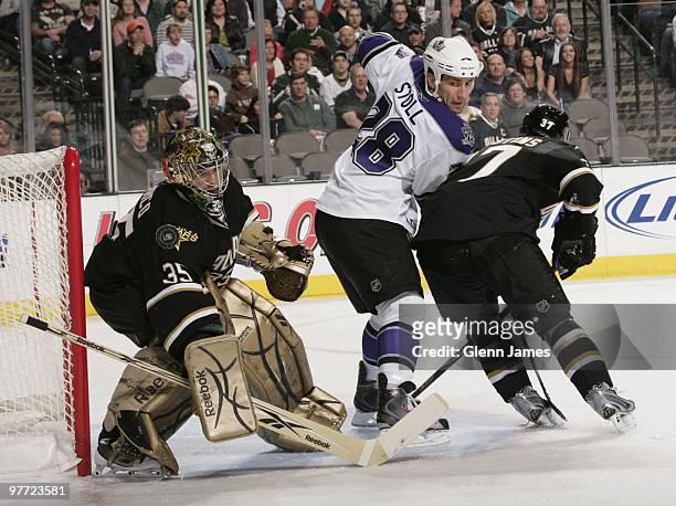 Jarret Stoll of the Los Angeles Kings tries to re-direct a puck against Marty Turco and Karlis Skrastins of the Dallas Stars on March 12, 2010 at the...