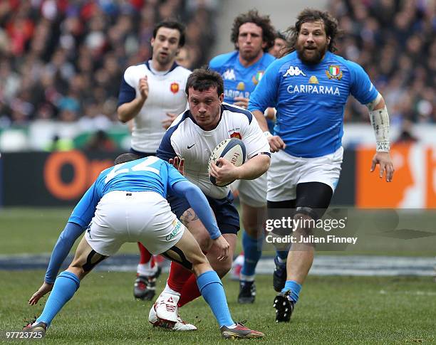 Thomas Domingo of France runs at Kaine Robertson of Italy during the RBS Six Nations match between France and Italy at Stade de France on March 14,...