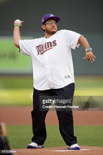 Omarr Baker, brother of the late Prince, delivers a ceremonial pitch before the game between the Minnesota Twins and the Los Angeles Angels of...
