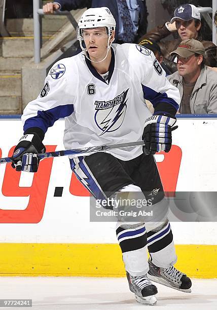 Kurtis Foster of the Tampa Bay Lightning skates during game action against the Toronto Maple Leafs March 11, 2010 at the Air Canada Centre in...