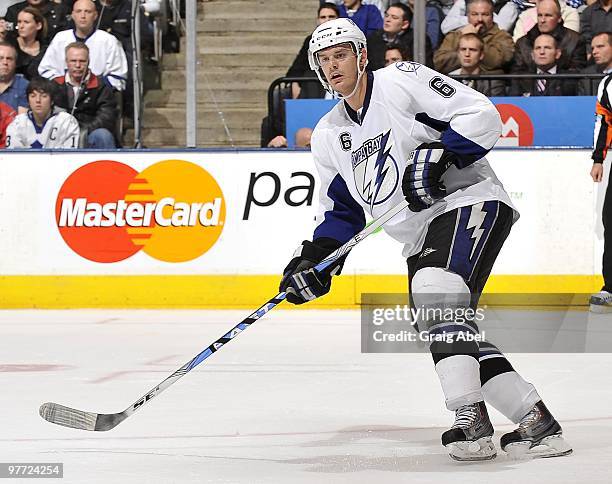 Kurtis Foster of the Tampa Bay Lightning skates during game action against the Toronto Maple Leafs March 11, 2010 at the Air Canada Centre in...