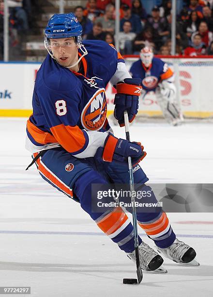 Bruno Gervais of the New York Islanders moves up ice against the New Jersey Devils in an NHL game at the Nassau Coliseum on March 13, 2010 in...