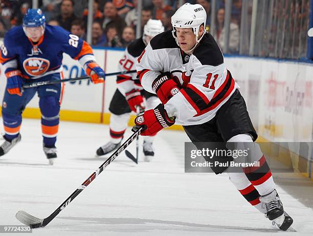 Dean McAmmond of the New Jersey Devils skates up ice against the New York Islanders in an NHL game at the Nassau Coliseum on March 13, 2010 in...