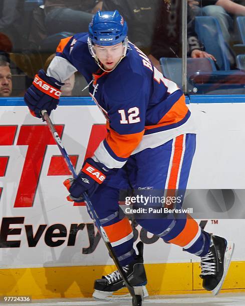 Josh Bailey of the New York Islanders moves up ice against the New Jersey Devils in an NHL game at the Nassau Coliseum on March 13, 2010 in...