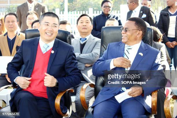 Slumber Tsogwane, Vice President of the Republic of Botswana and Miles Nan, Chairperson of the Charity Association of Chinese in Botswana sharing a...
