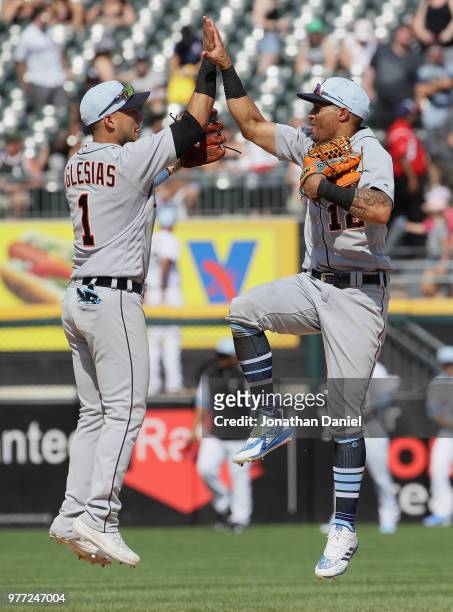 Jose Iglesias and Leonys Martin of the Detroit Tigers celebrate a win over the Chicago White Sox at Guaranteed Rate Field on June 17, 2018 in...