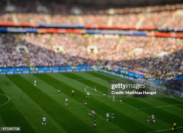 Jesus Gallardo of Mexico and Mesut Oezil of Germany compete for the ball during the 2018 FIFA World Cup Russia group F match between Germany and...