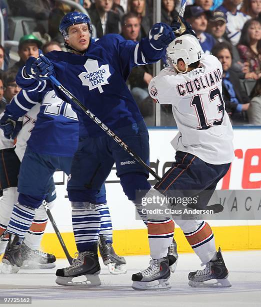 Nikolai Kulemin of the Toronto Maple Leafs collides with Andrew Cogliano of the Edmonton Oilers in a game on March 13, 2010 at the Air Canada Centre...