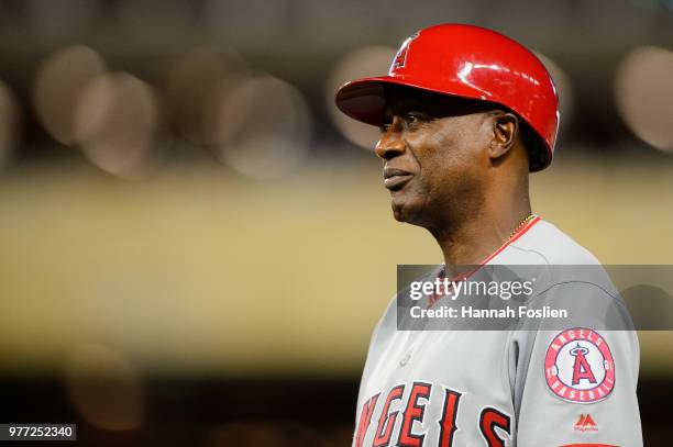 First base coach Alfredo Griffin of the Los Angeles Angels of Anaheim looks on during the game against the Minnesota Twins on June 8, 2018 at Target...