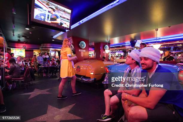 World Cup football fans watch the Germany v Mexico game on a TV in an American themed diner, near Red Square on June 17, 2018 in Moscow, Russia....