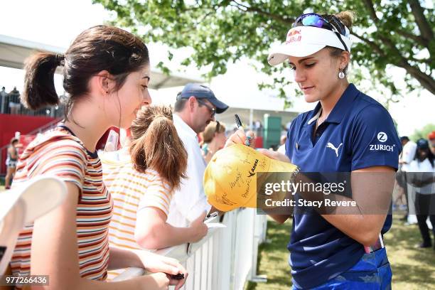 Lexi Thompson signs autographs for fans during the final round of the Meijer LPGA Classic for Simply Give at Blythefield Country Club on June 17,...