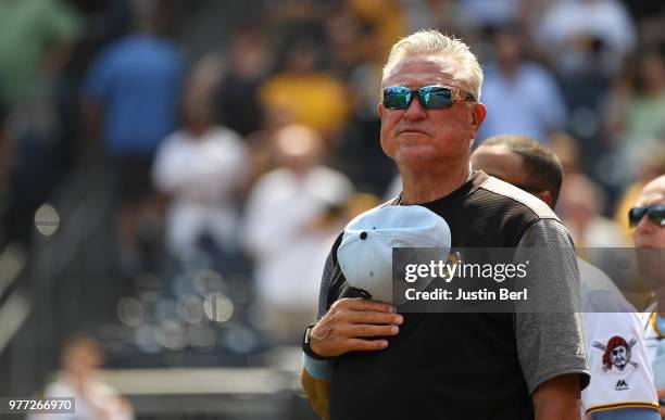 Clint Hurdle of the Pittsburgh Pirates stands at attention during the playing of God Bless America in the seventh inning during the game against the...