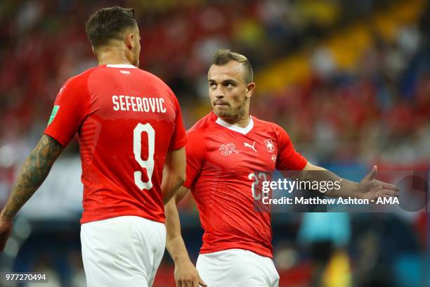 Haris Seferovic of Switzerland speaks to Xherdan Shaqiri of Switzerland during the 2018 FIFA World Cup Russia group E match between Brazil and...