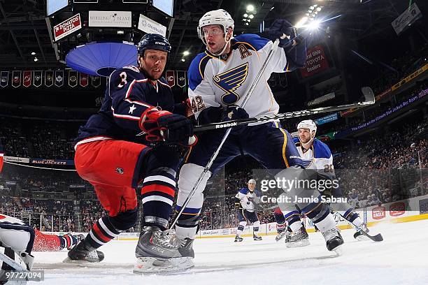 Defenseman Marc Methot of the Columbus Blue Jackets defends against forward David Backes of the St. Louis Blues on March 13, 2010 at Nationwide Arena...