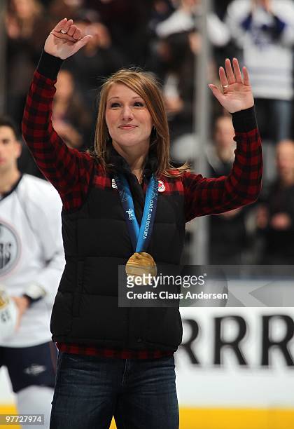 Bobsleigh gold medalist Heather Moyse salutes the crowd prior to a game between the Toronto Maple Leafs and Edmonton Oilers on March 13, 2010 at the...