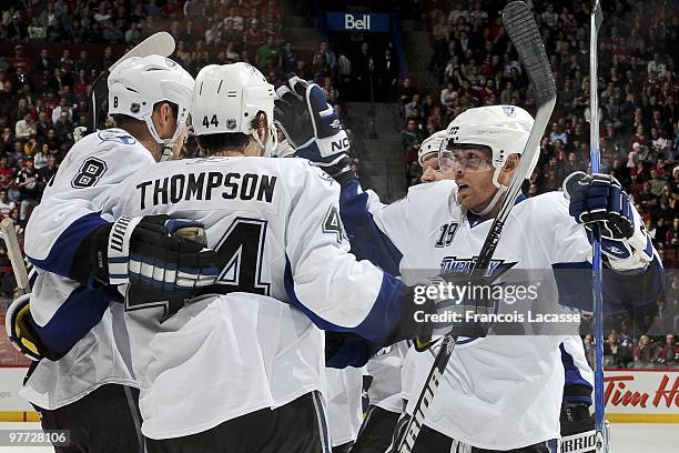 Stephane Veilleux of the Tampa Bay Lightning celebrates a goal with teammate Nate Thompson during the NHL game againt the Montreal Canadiens on March...