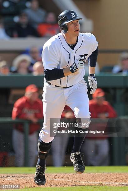 Don Kelly of the Detroit Tigers watches his seventh inning two-run homer as he runs to first base against the Houston Astros during a spring training...