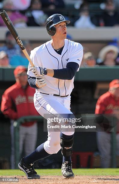 Don Kelly of the Detroit Tigers watches his seventh inning two-run homer while batting against the Houston Astros during a spring training game at...