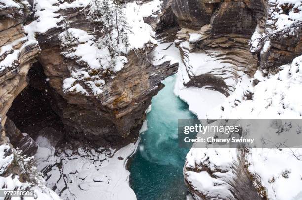 athabasca falls in winter, jasper national park, alberta, canada - athabasca river stock pictures, royalty-free photos & images