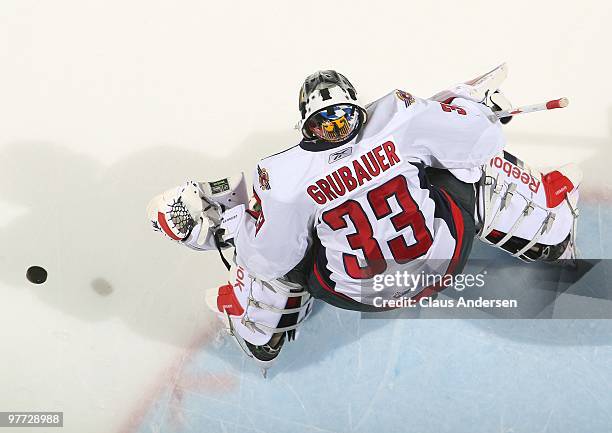 Philipp Grubauer of the Windsor Spitfires stops a shot in warm-up prior to a game against the London Knights on March 12, 2010 at the John Labatt...