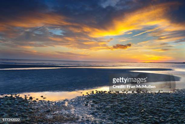 rocky beach at sunset, old saybrook, connecticut, usa - connecticut landscape stock pictures, royalty-free photos & images