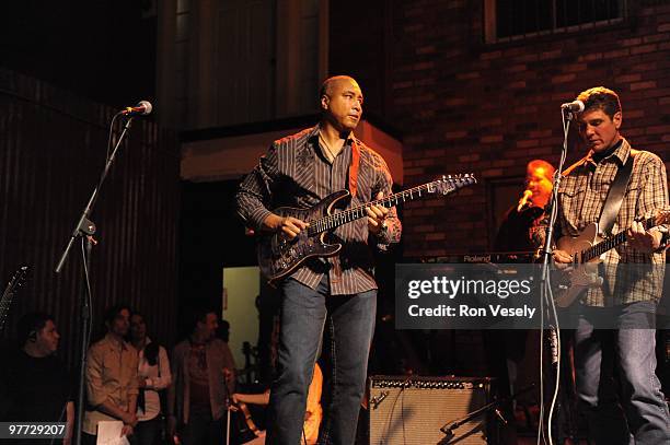 Former New York Yankee player Bernie Williams plays guitar on stage in front of 1,400 fans and fellow Cactus League players during Jake Peavy's...