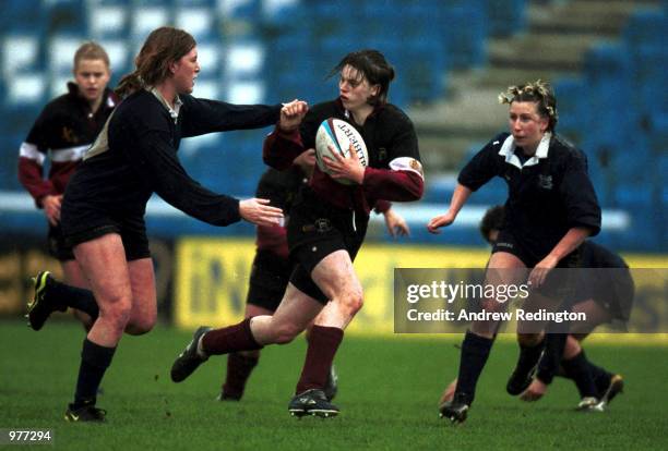 Charlotte A Barras of Loughborough University breaks away from Karen Jones of Oxford University during the British Universities Halifax Women's Rugby...