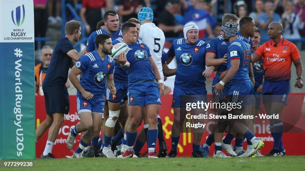 The France players celebrate the try scored by Adrien Seguret during the World Rugby via Getty Images Under 20 Championship Final between England and...