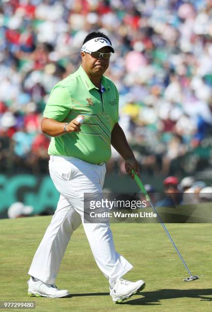 Kiradech Aphibarnrat of Thailand waves after putting on the ninth green during the final round of the 2018 U.S. Open at Shinnecock Hills Golf Club on...